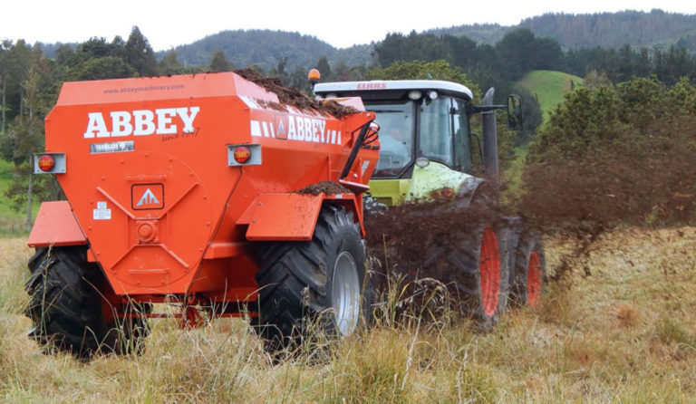 Abbey Machinery AP Multi Spreader in use hitched to tractor in field