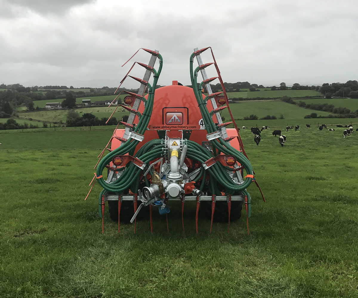 Abbey Machinery Band Spreader in field with cattle