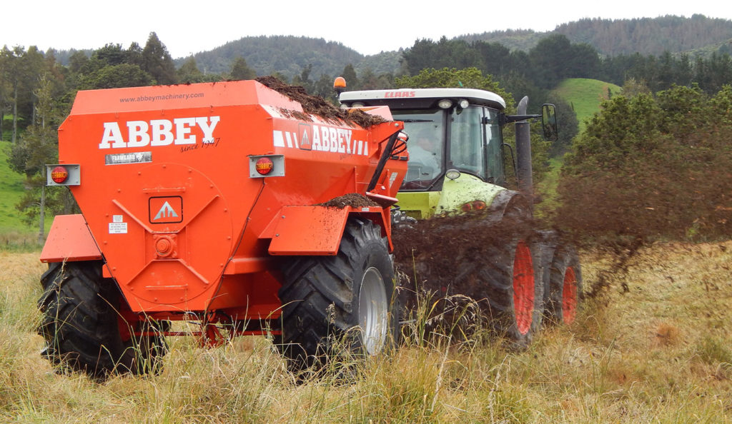 Abbey Machinery AP Multi Spreader in use hitched to tractor in field