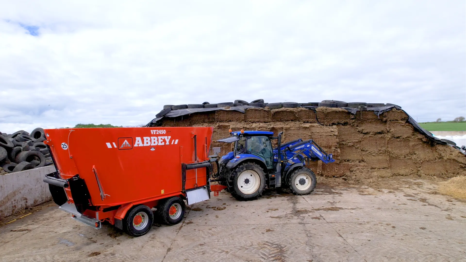 Abbey Machinery Twin Auger Vertical Feeder VF2450 on farm with tractor and feed