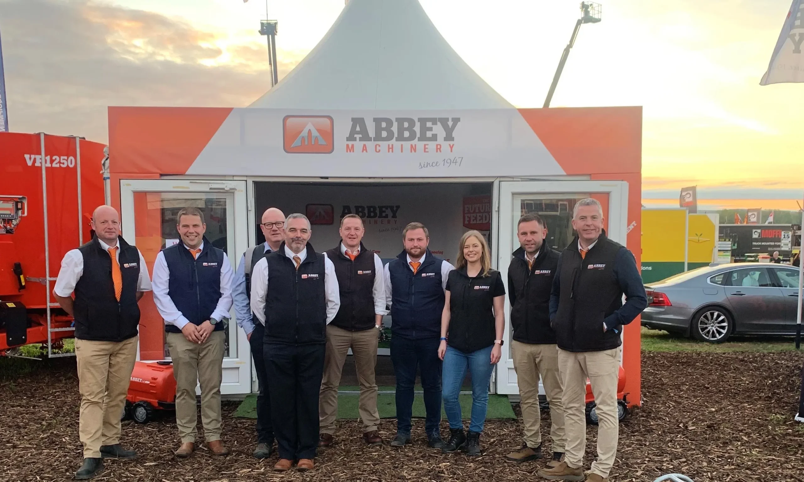 Abbey Machinery staff outside tent