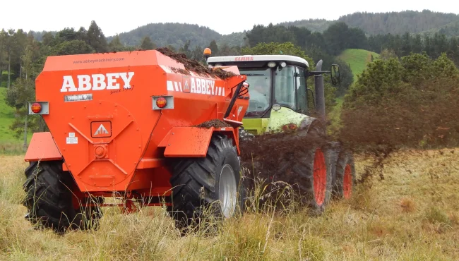 Abbey Machinery AP Multi Spreader in use hitched to tractor in field